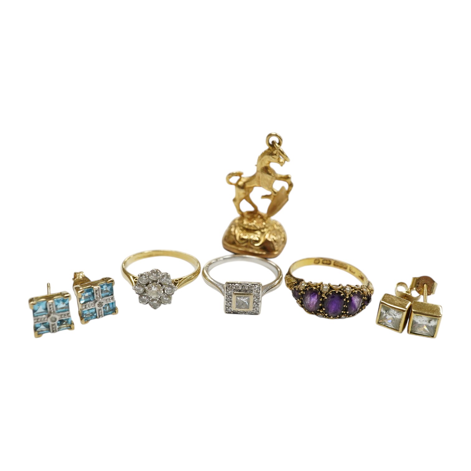 An 18ct and nine stone simulated diamond set cluster ring, a modern 18ct gold and diamond set square cluster ring, a Victorian 15ct gold, amethyst and seed pearl set half hoop ring, two pairs of 9ct and gem set ear studs